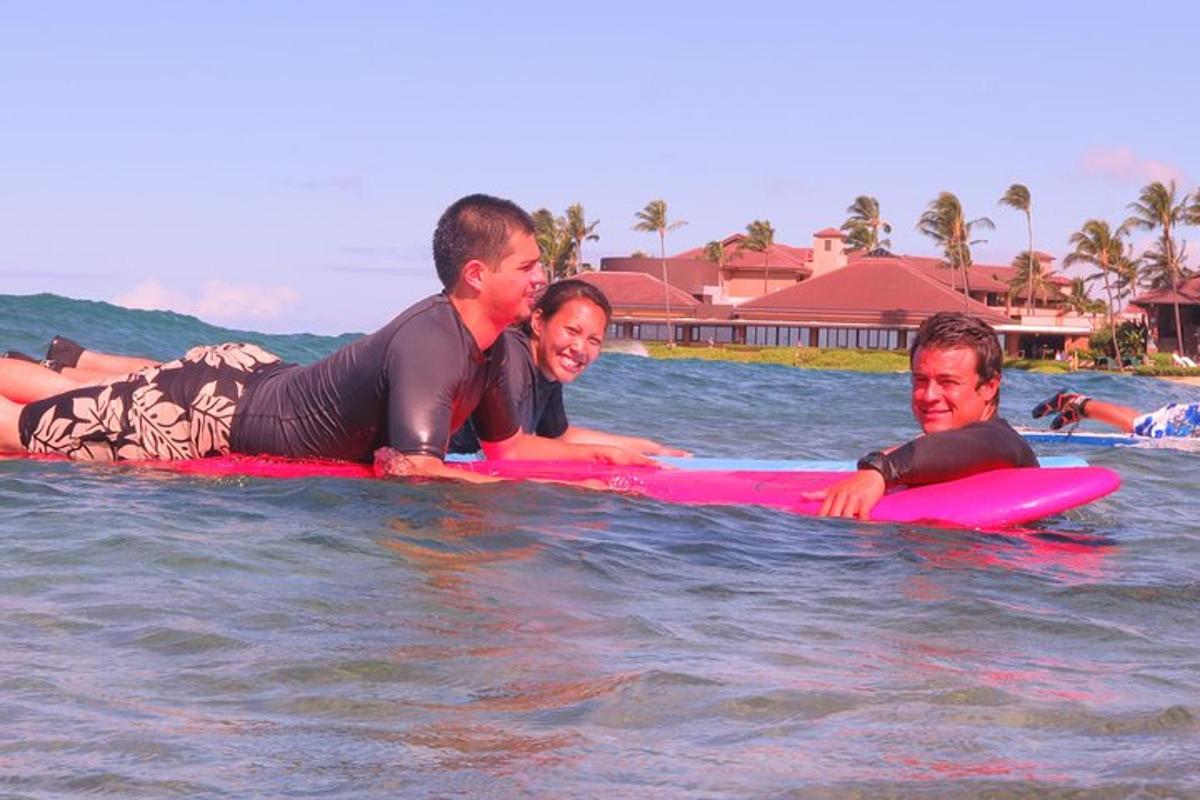 a group of people laying on surfboards in the water