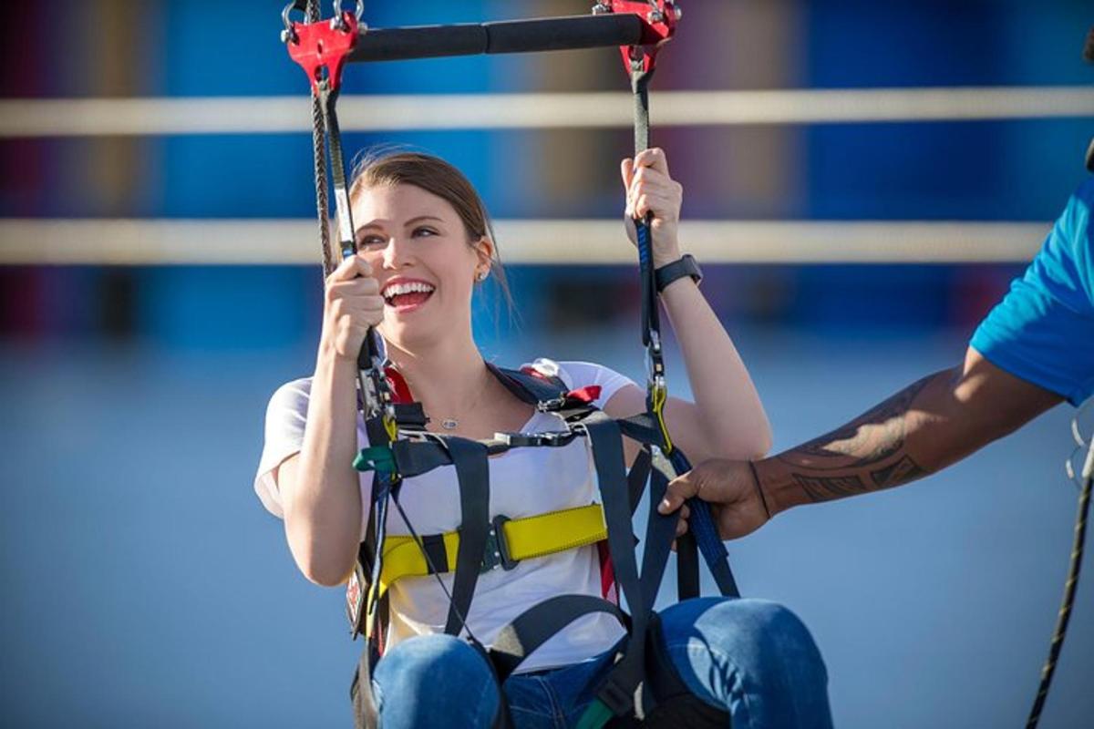a young girl on a swing with a man