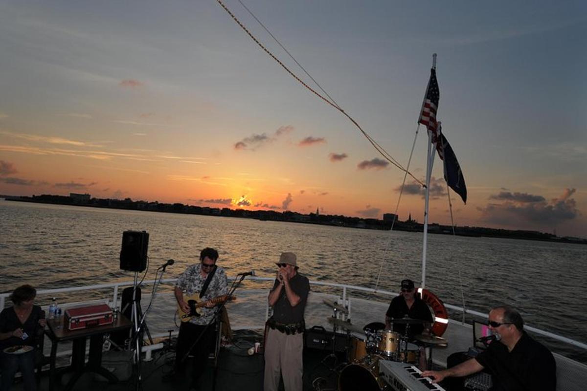 a group of people playing music on a boat on the water