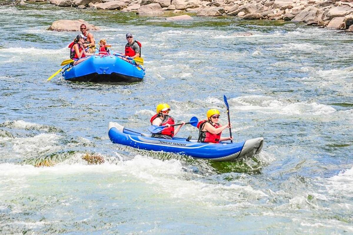 a group of people in rafts on a river