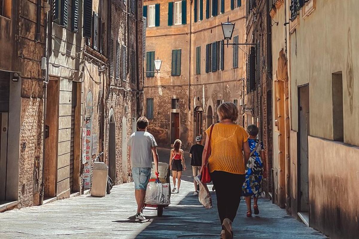 a group of people walking down an alley