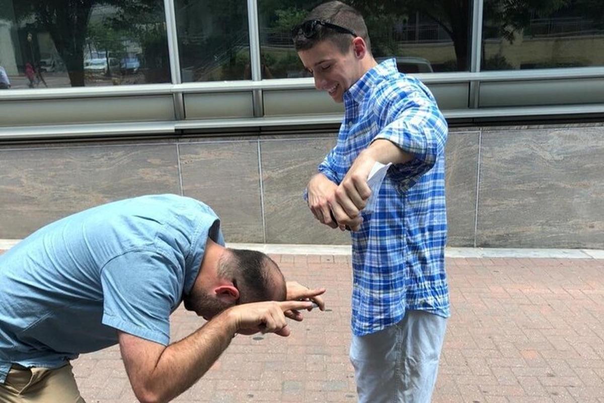 two men are standing next to each other