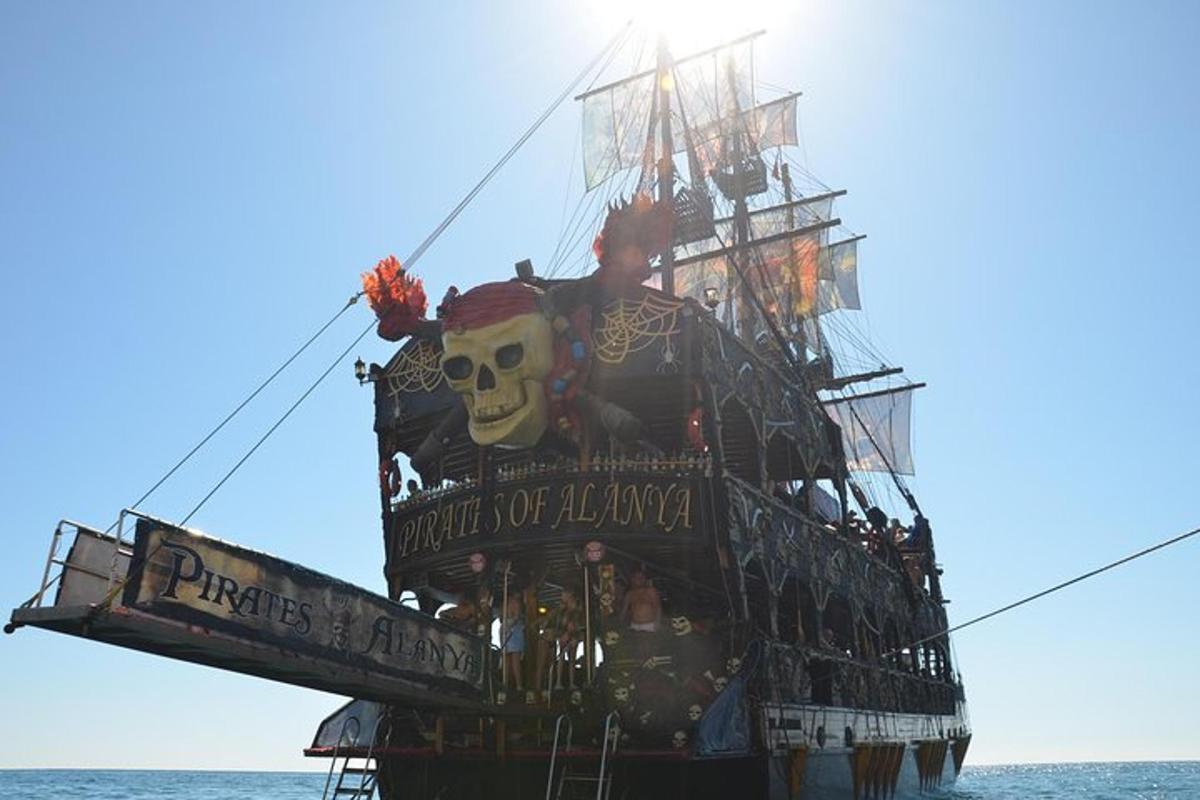a pirate ship with a skull on it in the ocean