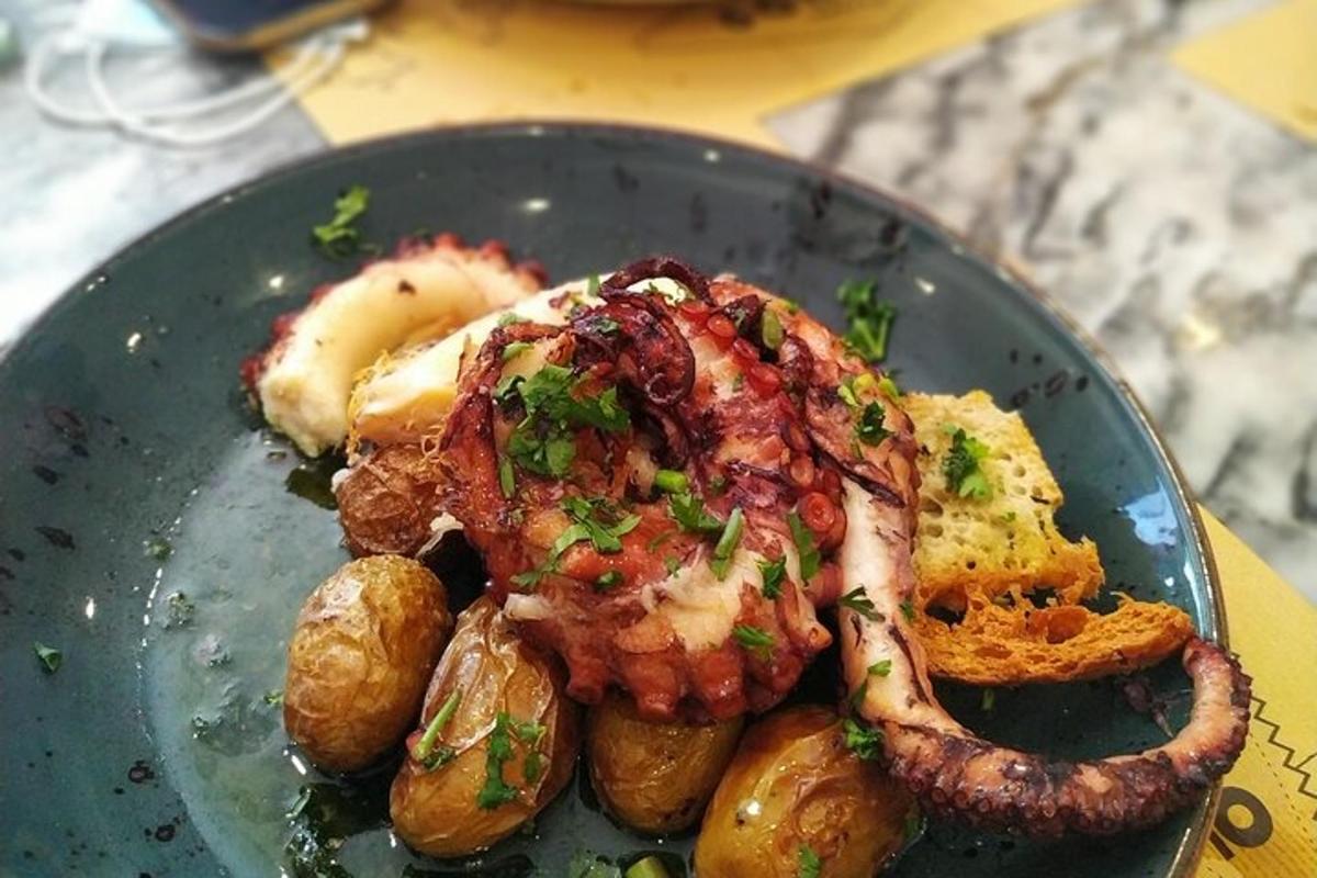 a plate of food with meat and potatoes on a table