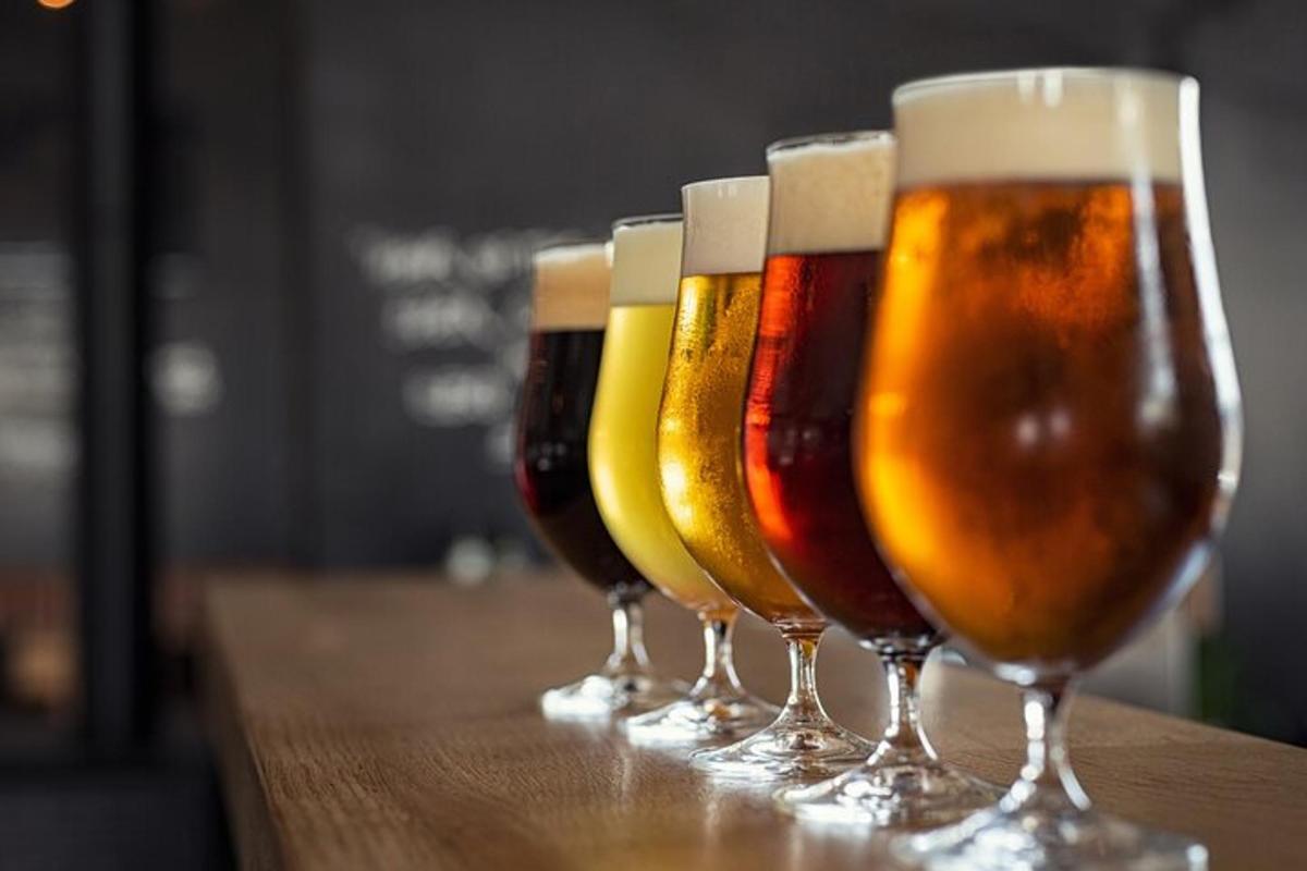 a row of beers lined up in a row on a table