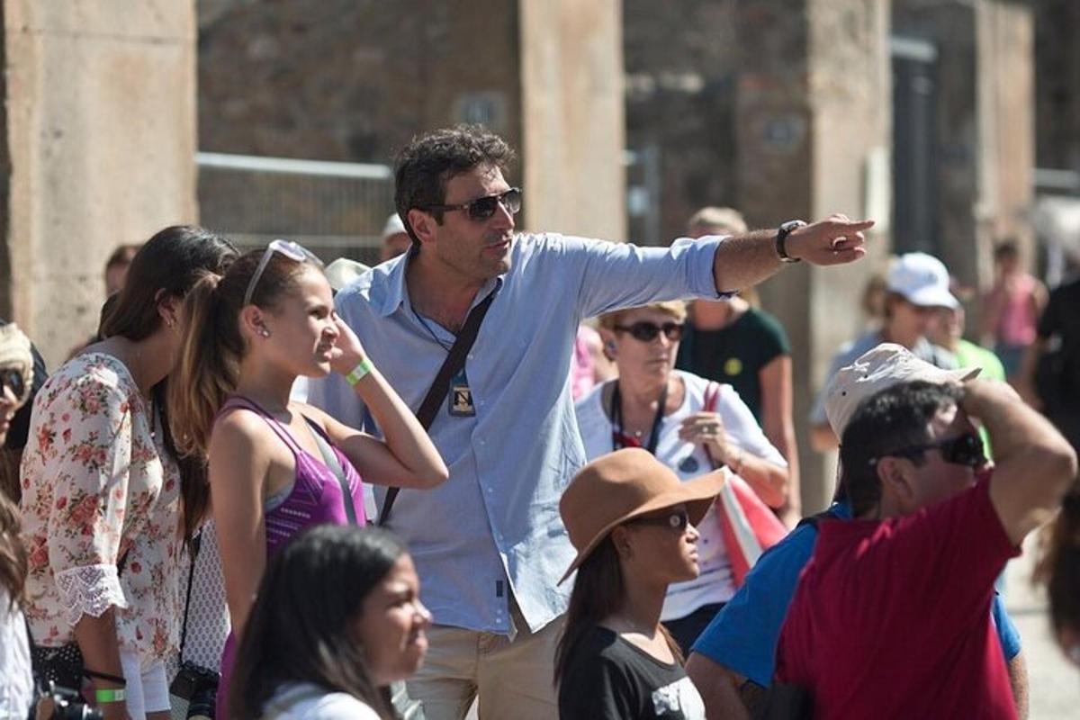 a man is pointing at a crowd of people