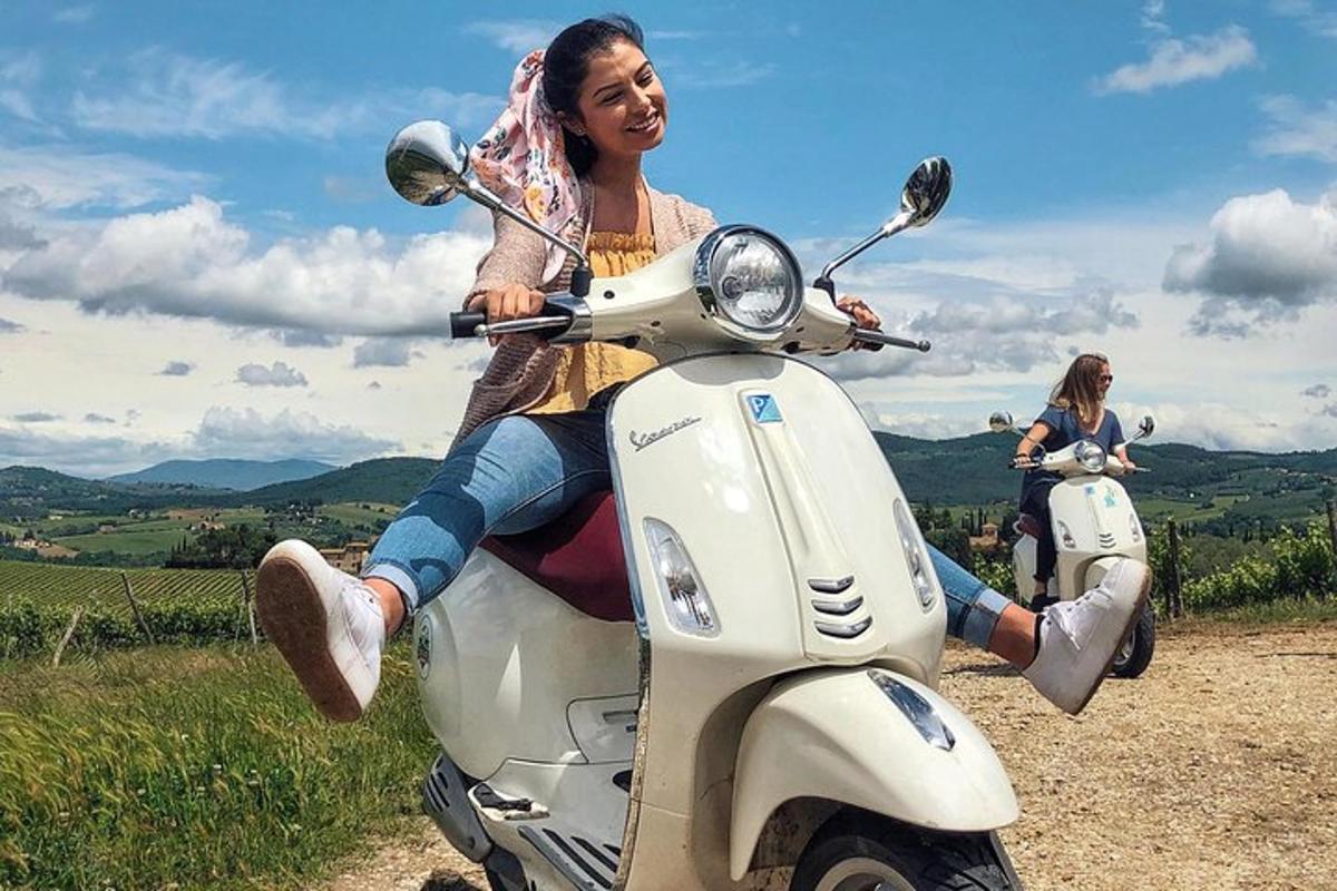 a woman is sitting on a scooter