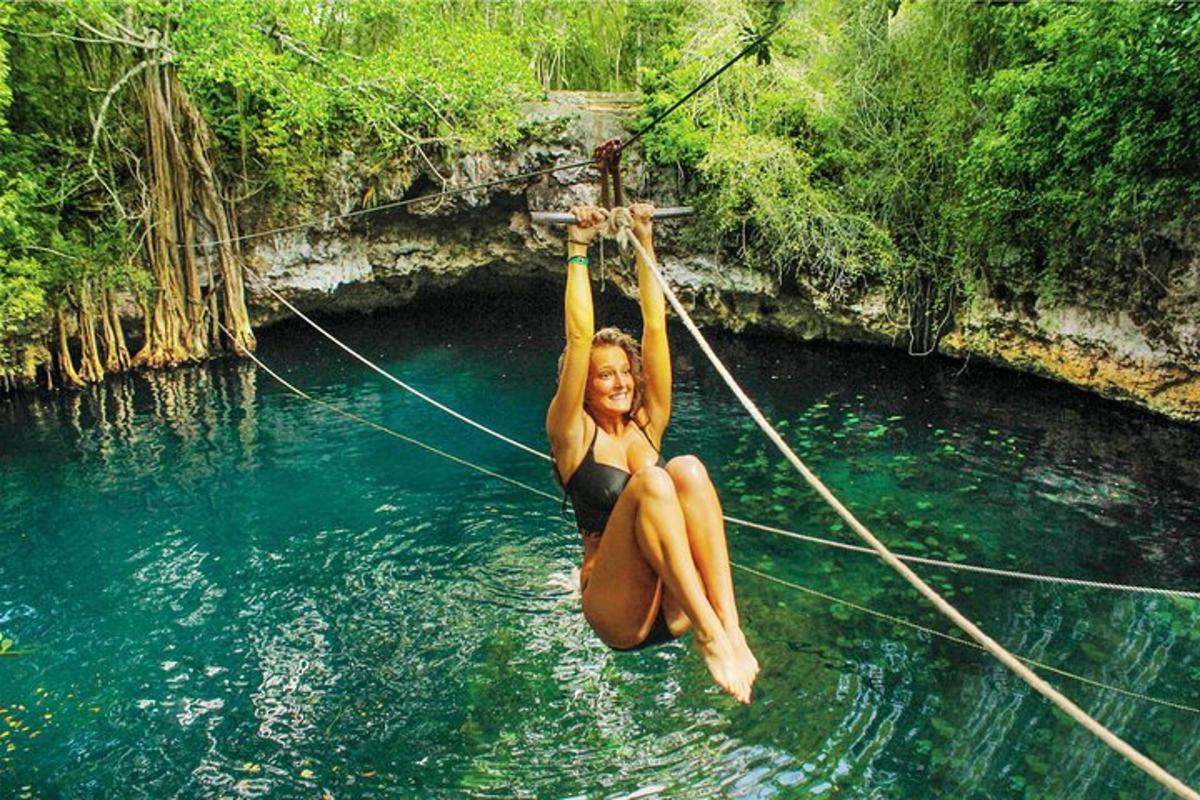 a woman is on a rope in the water
