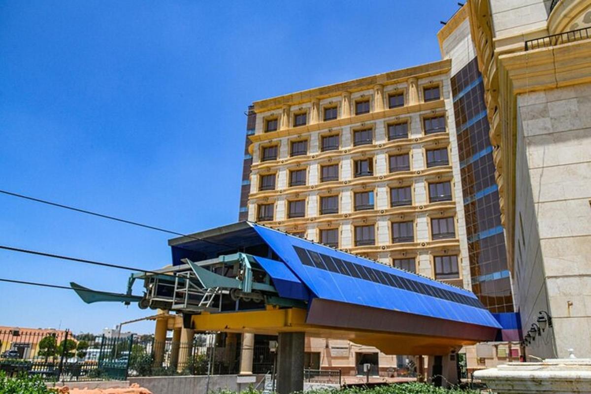 a building with a blue roof in front of a building