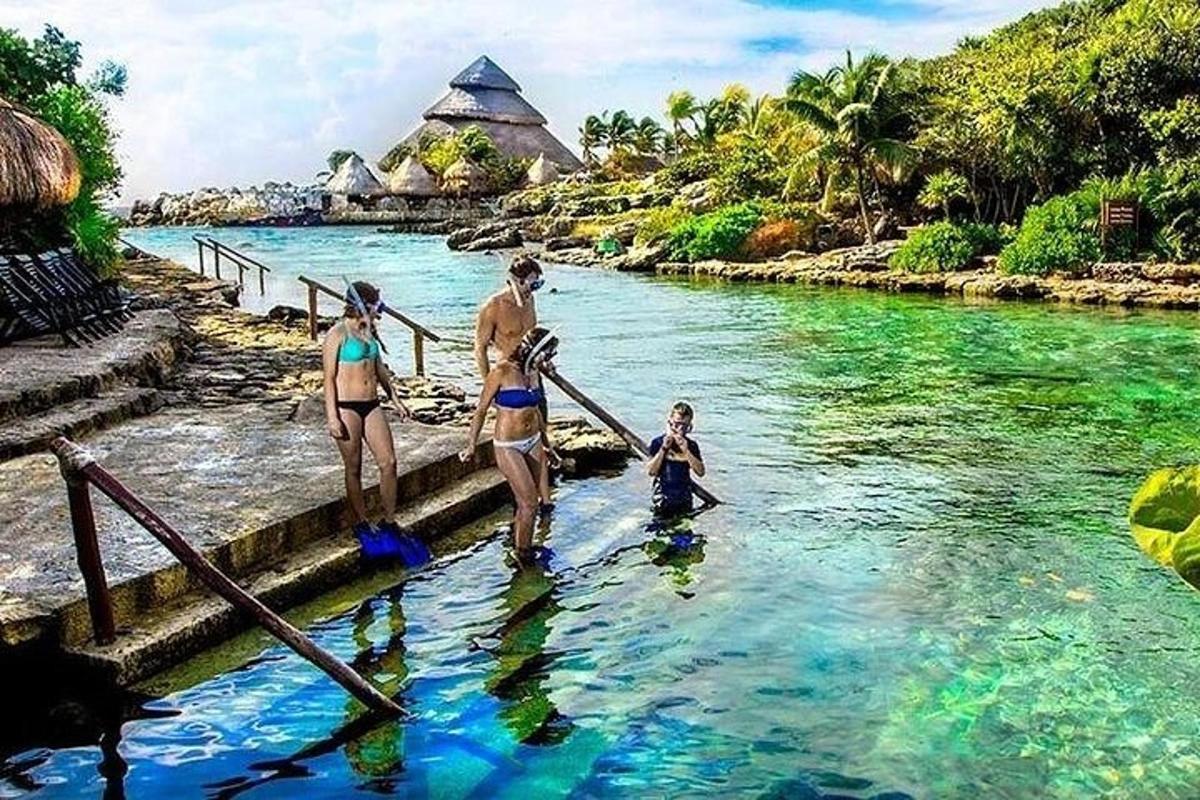 a family walking down steps in the water at a resort
