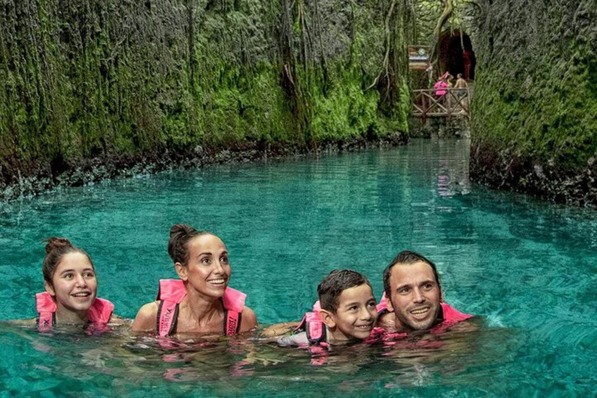 a group of people in a pool in the water