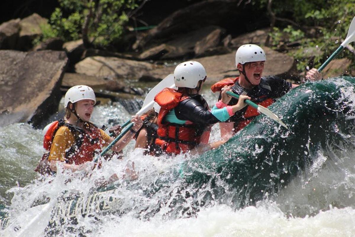 a group of people in a raft on a river