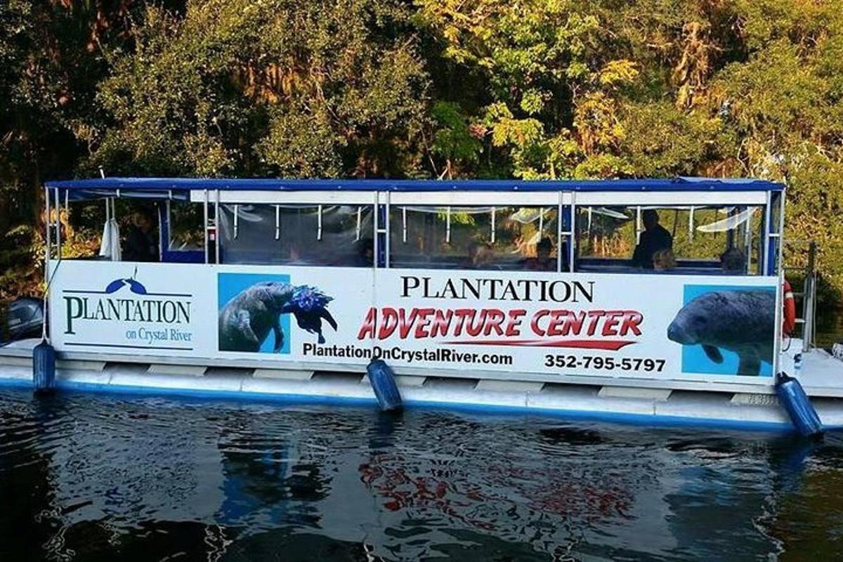 a tour boat on the water with people on it