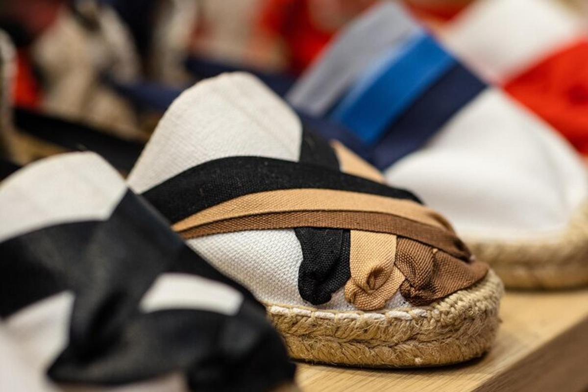 a close up of a pair of shoes with a bow tie