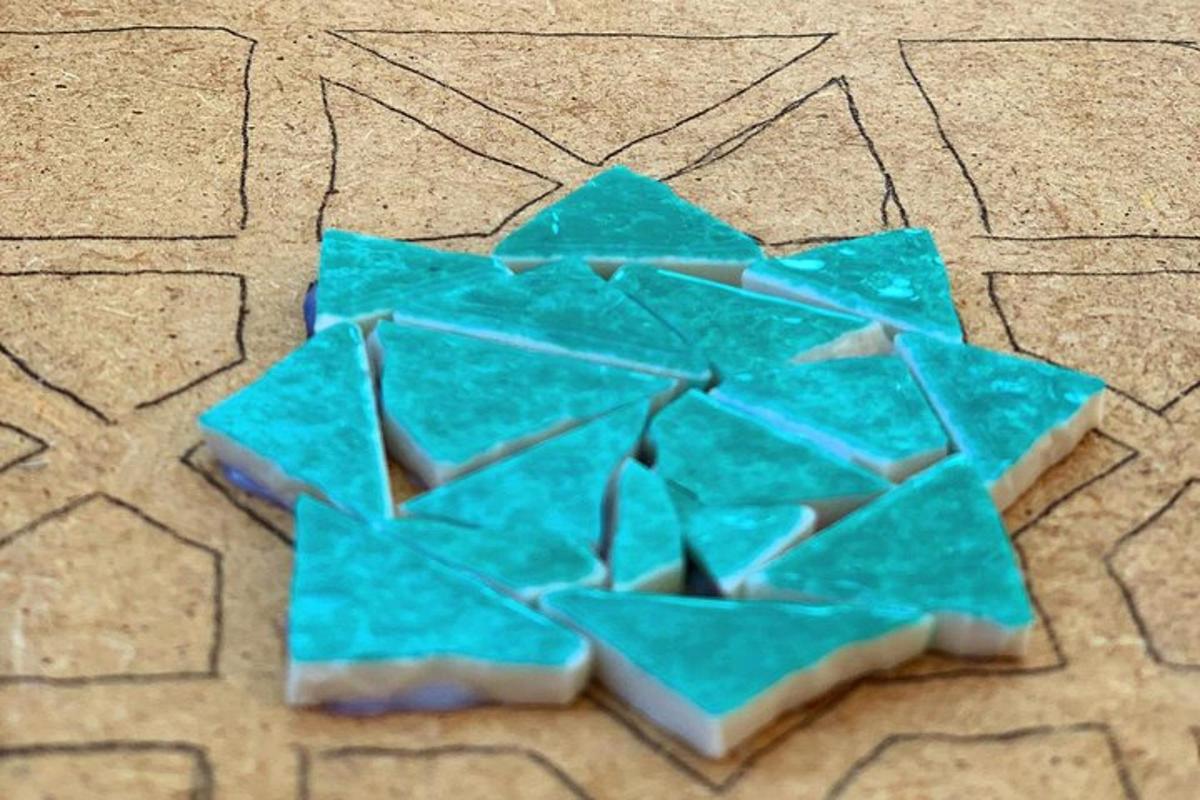 a piece of blue glass sitting on the ground