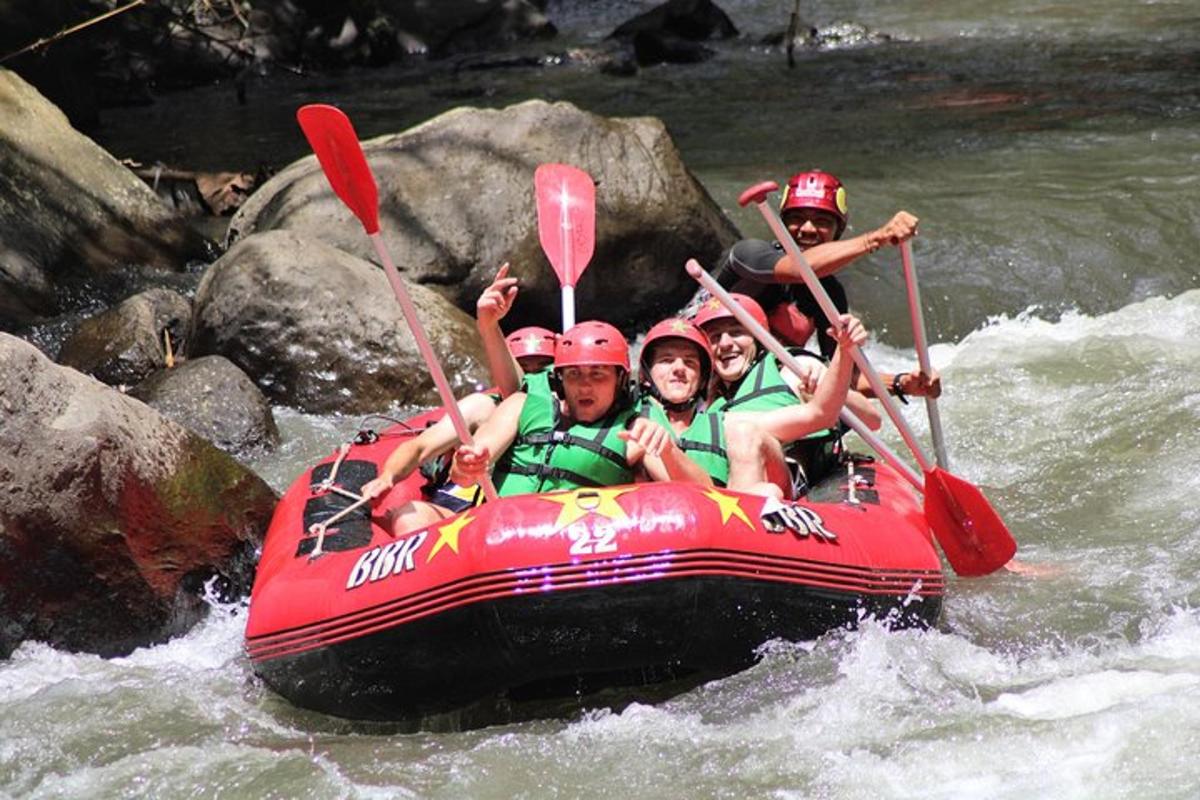 a group of people in a raft on a river