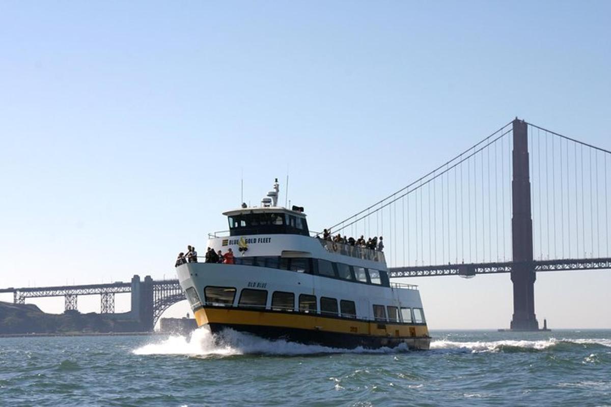 a boat in the water in front of a bridge