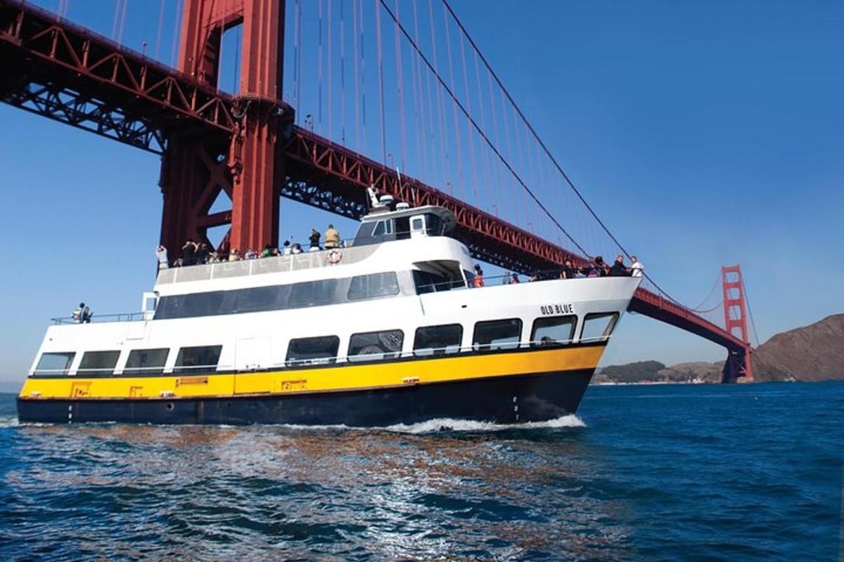 a boat sailing under the golden gate bridge