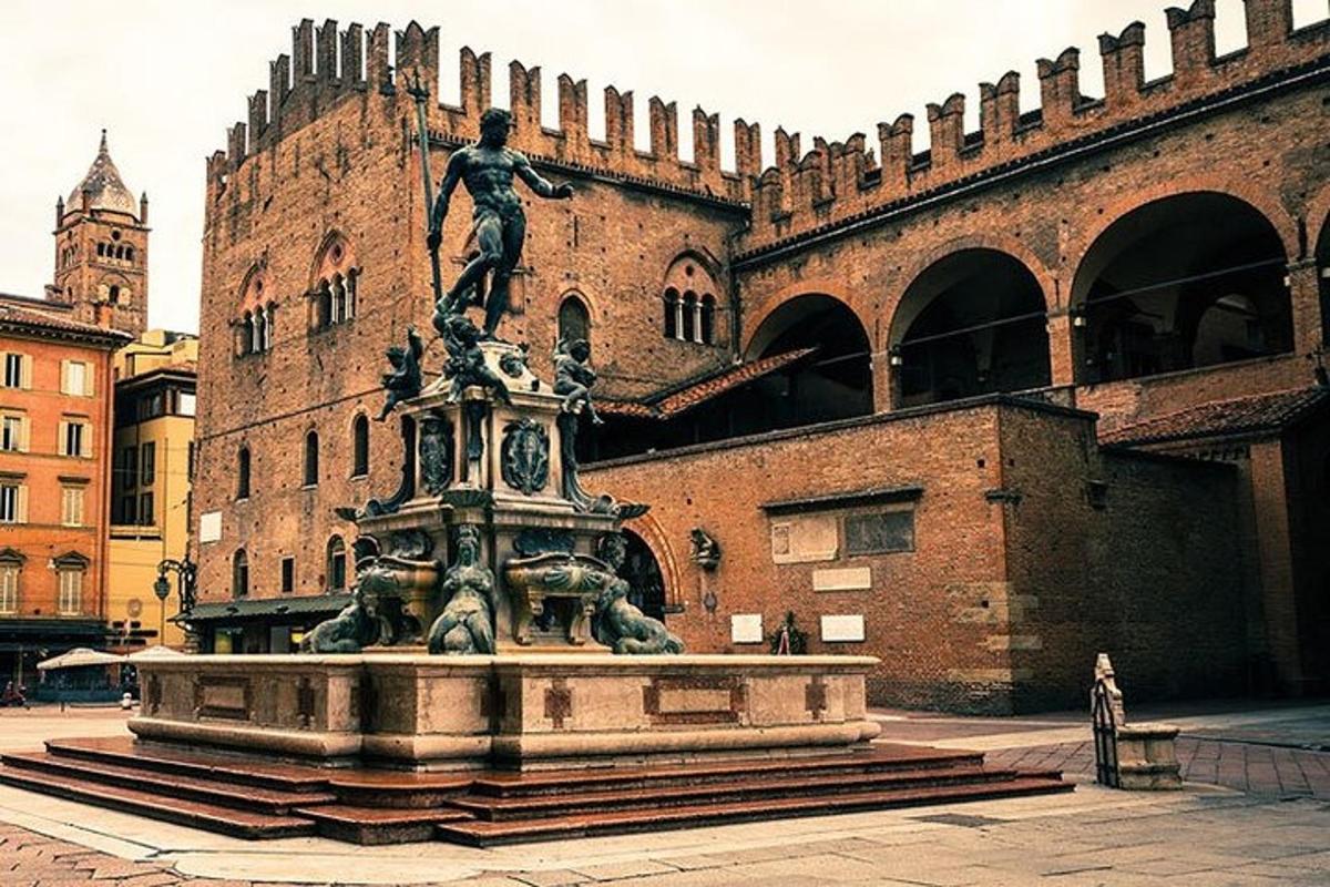 a statue of a man on top of a fountain in front of a building