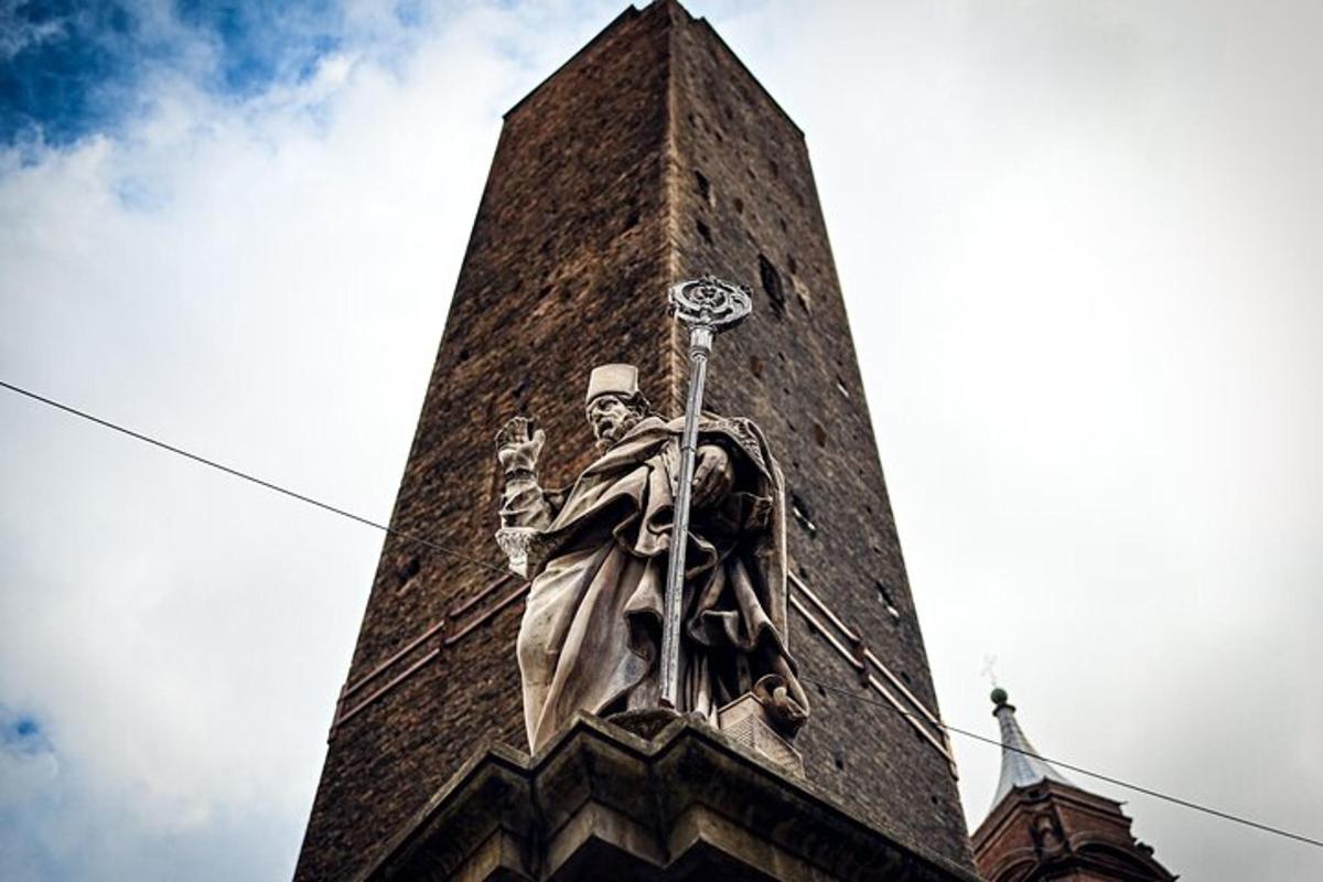a statue of a man on the side of a tower