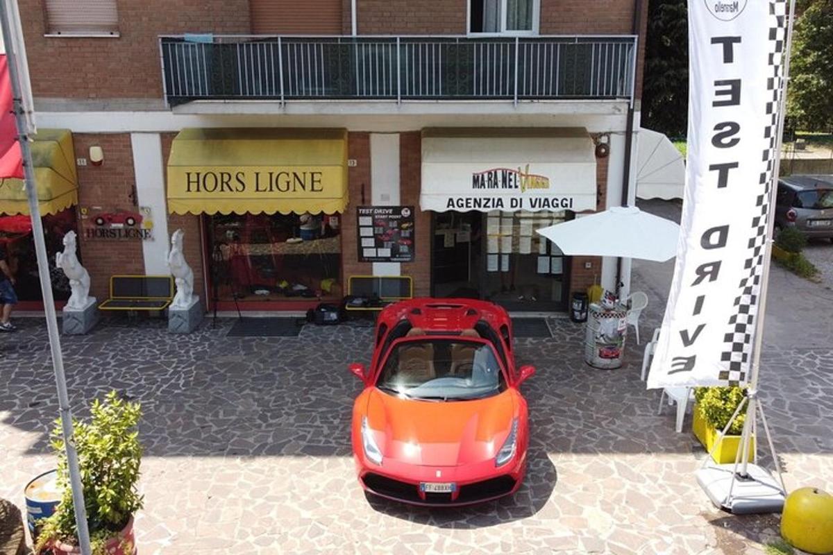 a small red car parked in front of a store