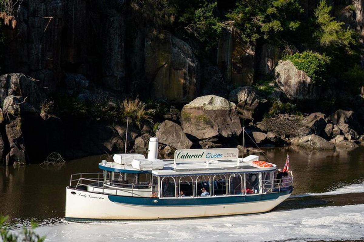 a boat on a river with people on it