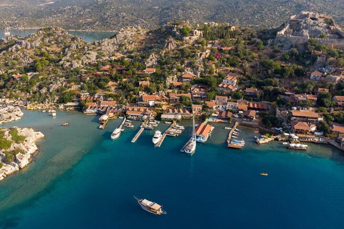 an aerial view of a harbor with boats in the water