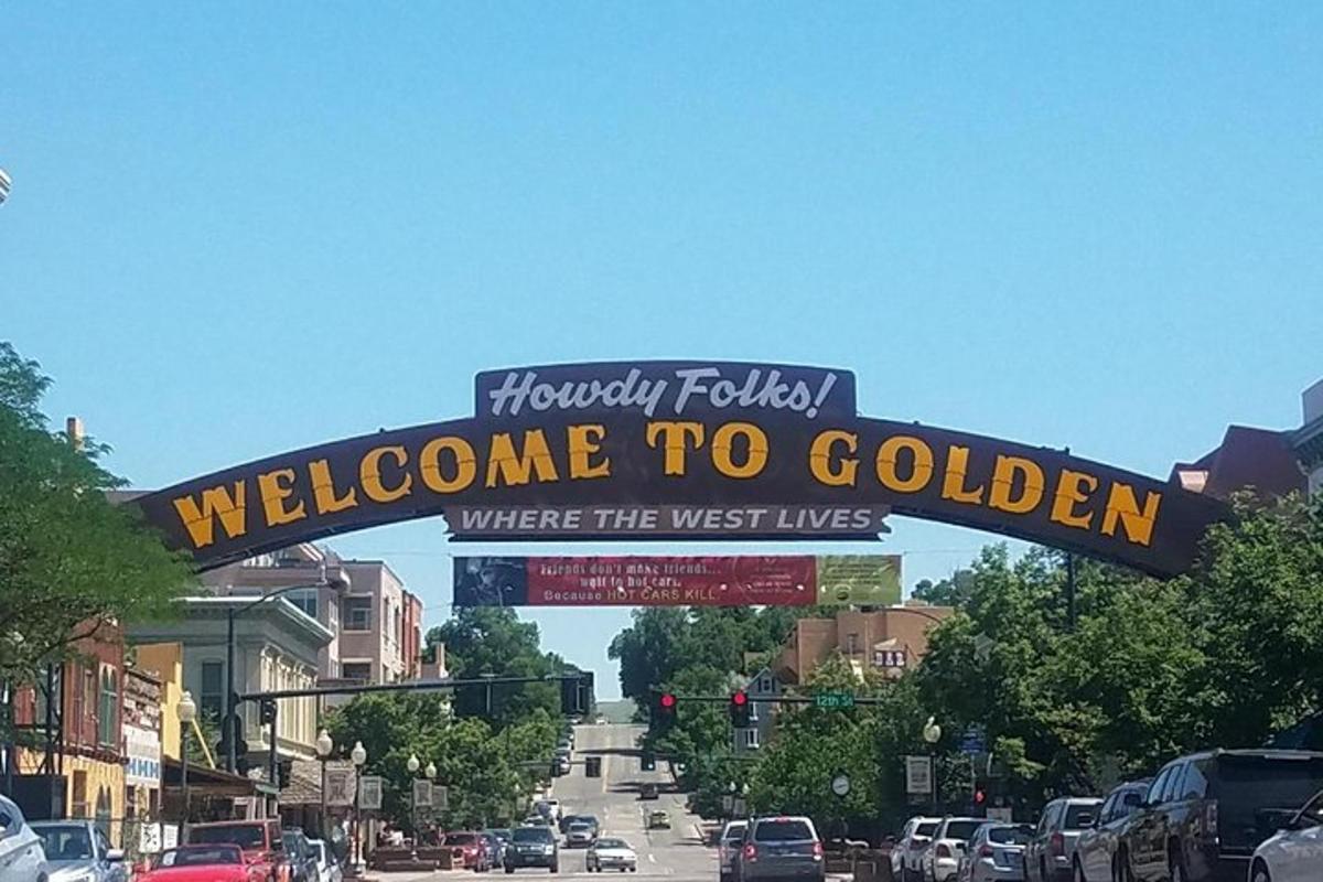 a welcome to golden sign on a city street
