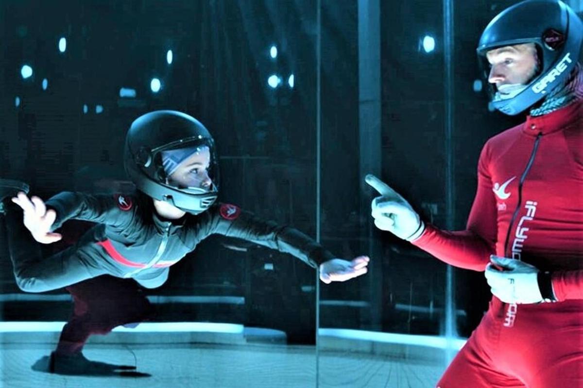 a man and a woman with helmets on their