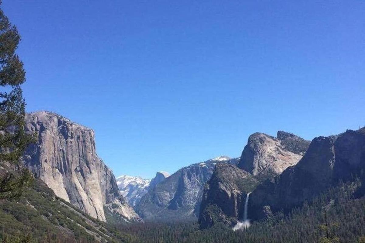 a mountain with a waterfall in the middle of it