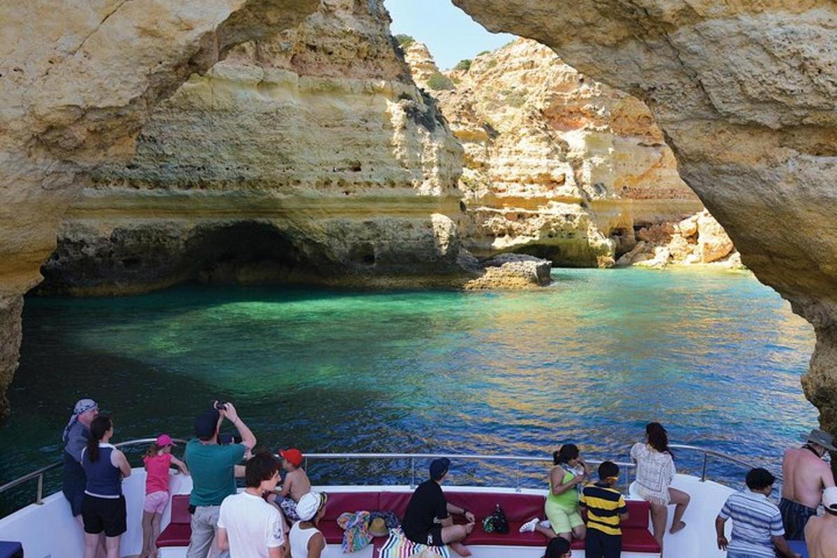 a group of people on a boat in a cave