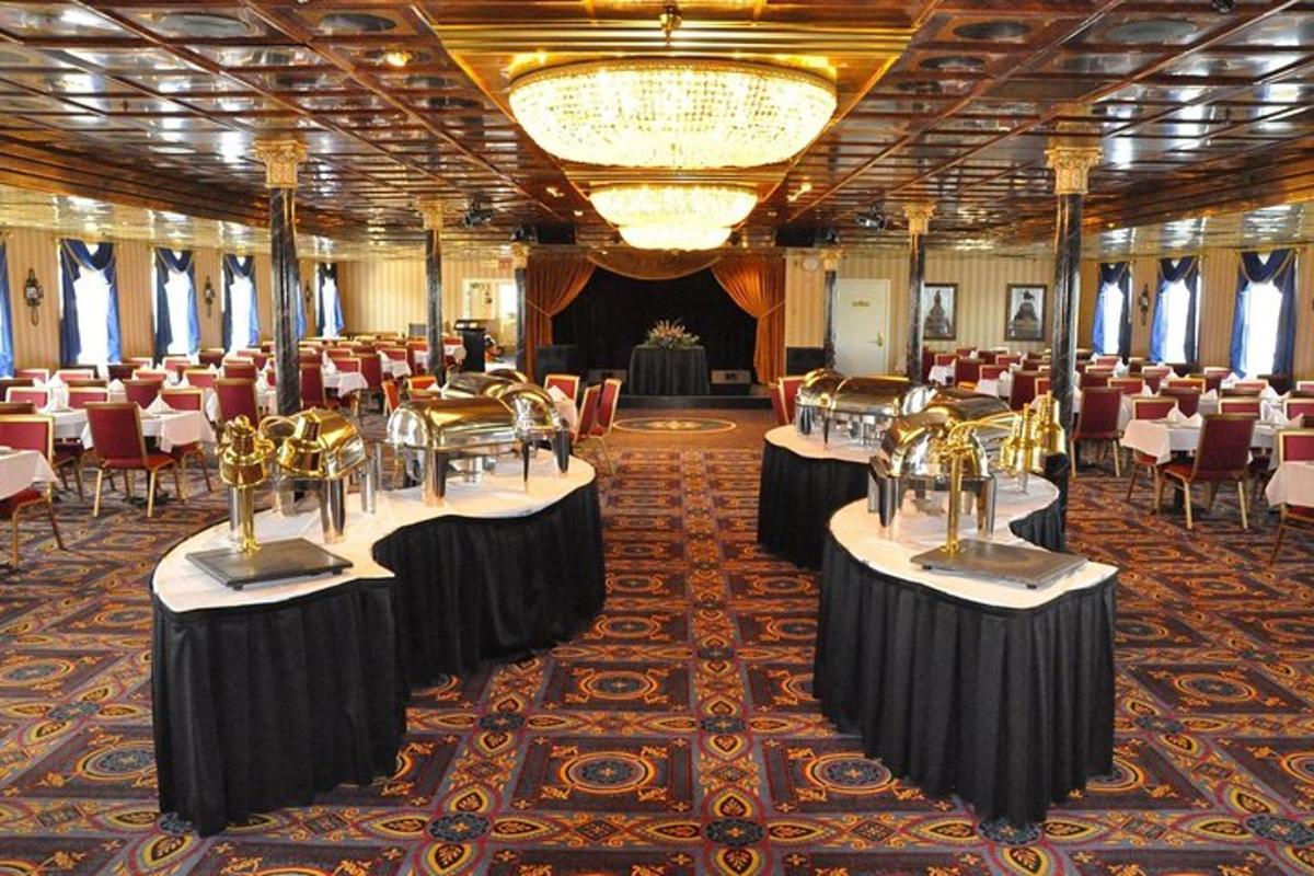 a banquet hall with tables and chairs and a chandelier