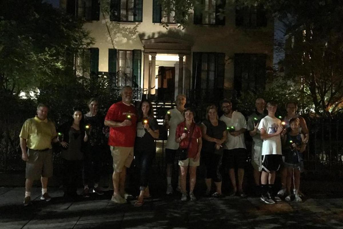 a group of people standing in front of a house
