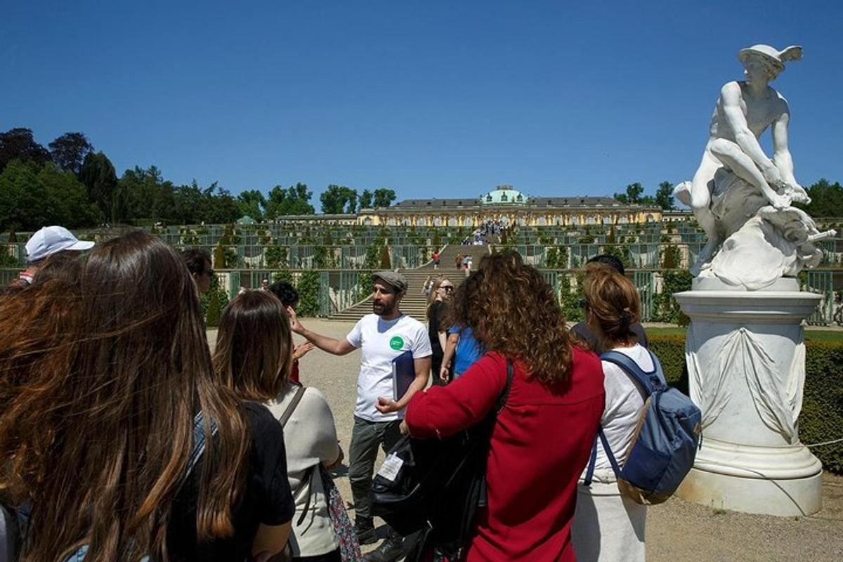 a group of people standing in front of a statue