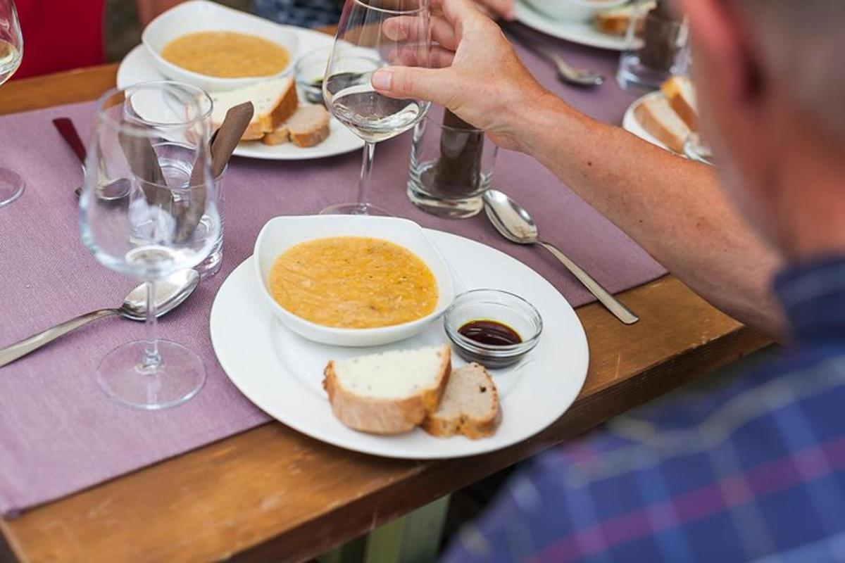 a man sitting at a table with a plate of food