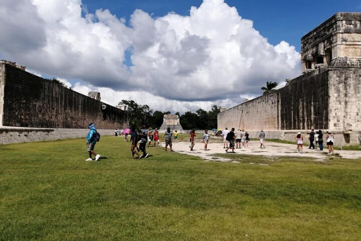 a group of people walking around the walls of aniseum