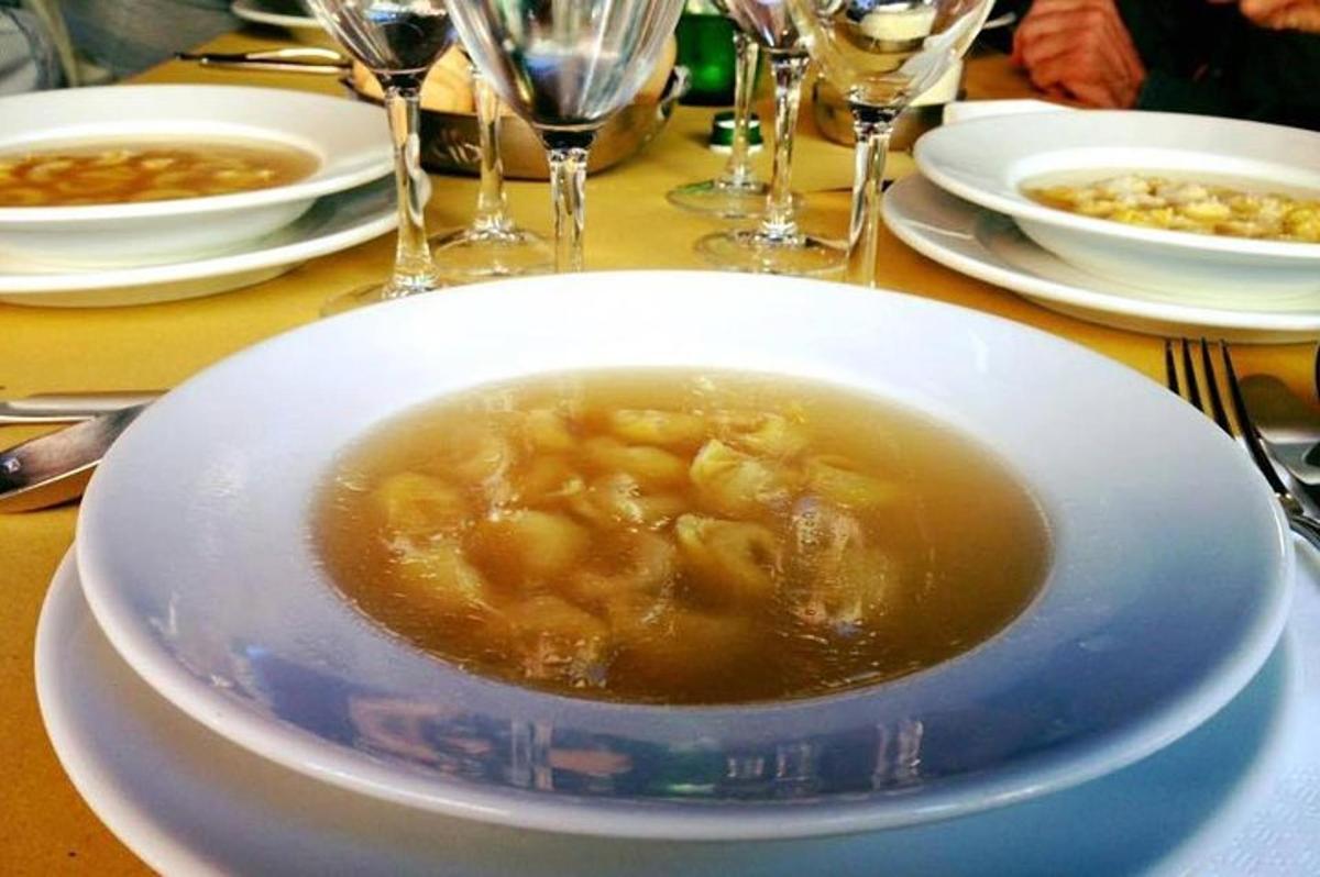 a bowl of soup on a plate on a table