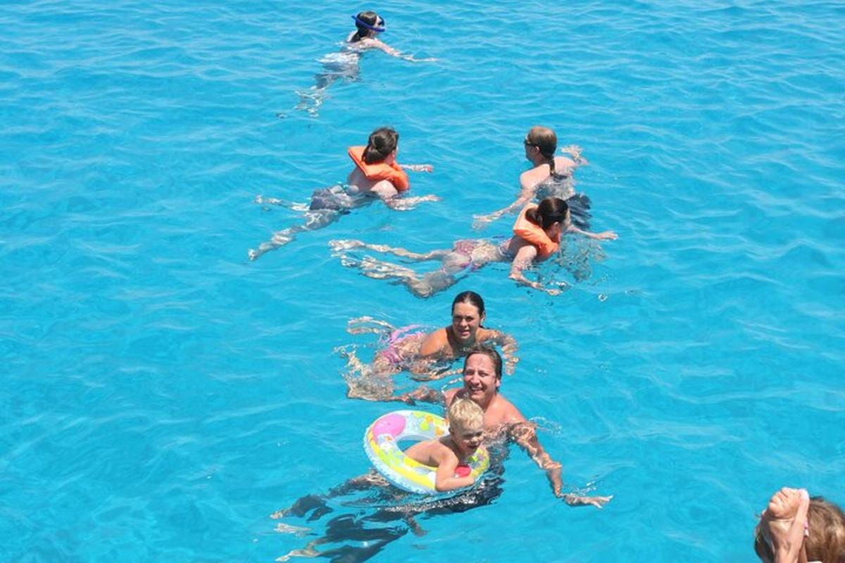 a group of people swimming in the water