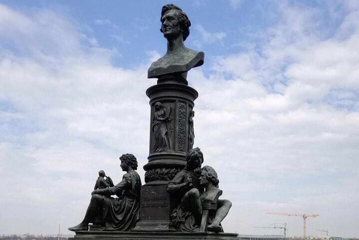 a statue with people sitting on top of it