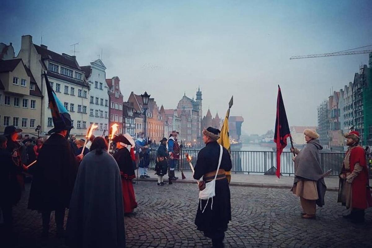 a group of people standing in a street holding flags