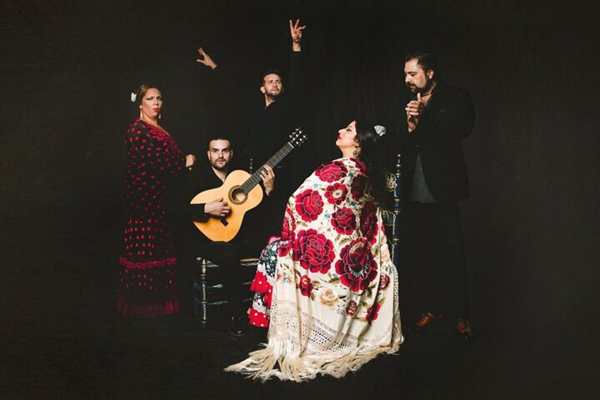 a group of people standing around a woman with a guitar