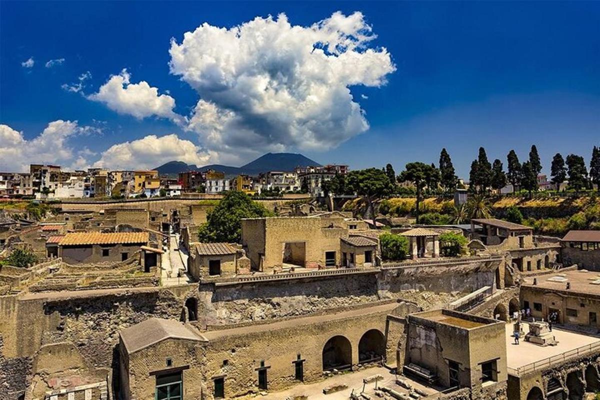 a view of a city with buildings and a cloudy sky