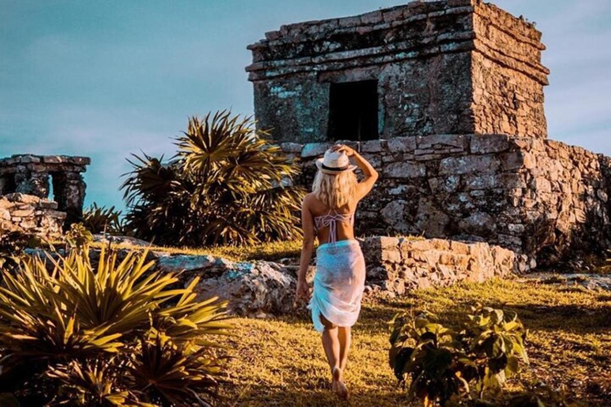 a woman walking in front of a building