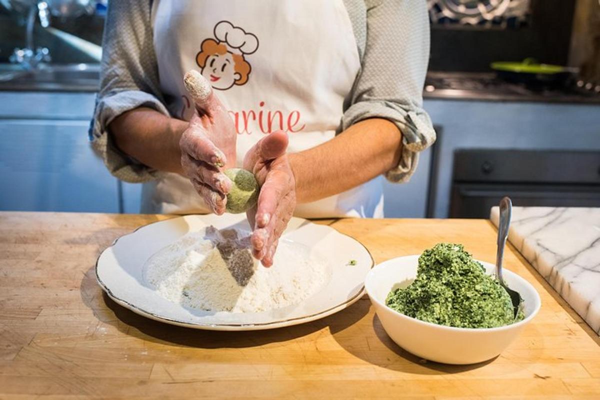 a person in a kitchen preparing food on a table