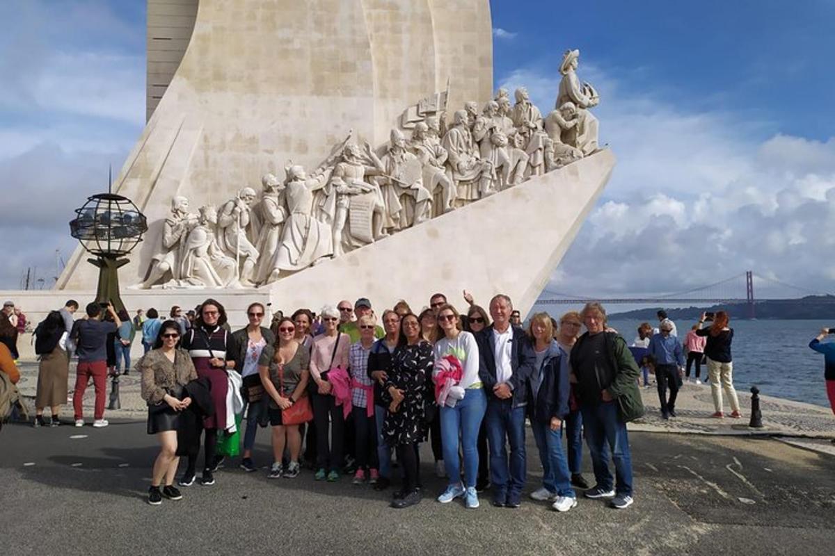 a group of people standing in front of a monument