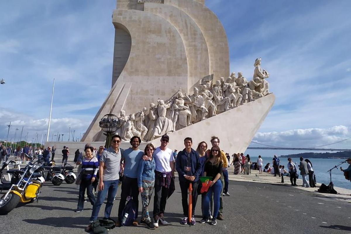 a group of people standing in front of a monument