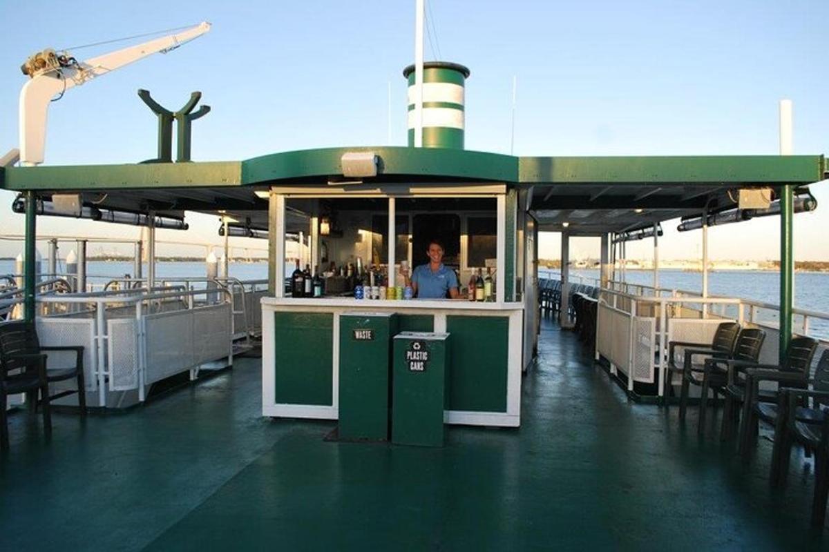 a bar on a boat with a person behind the counter