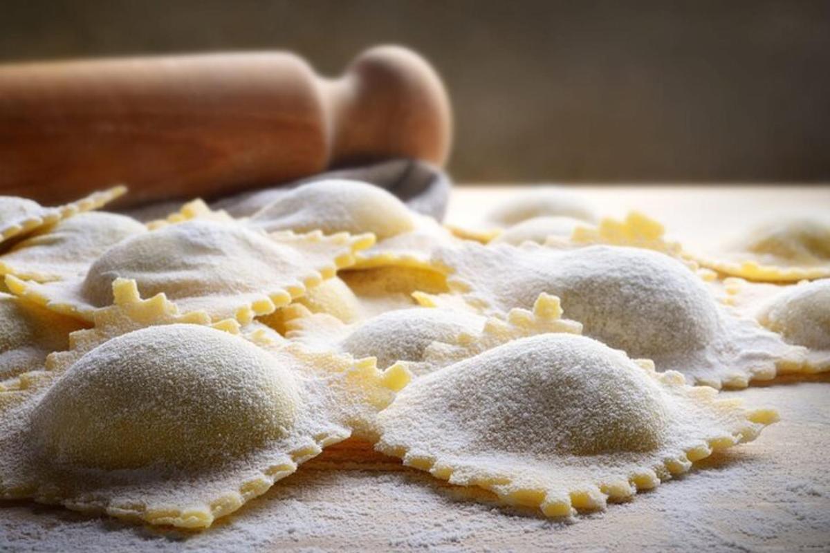 a pile of sugar covered cookies on a table