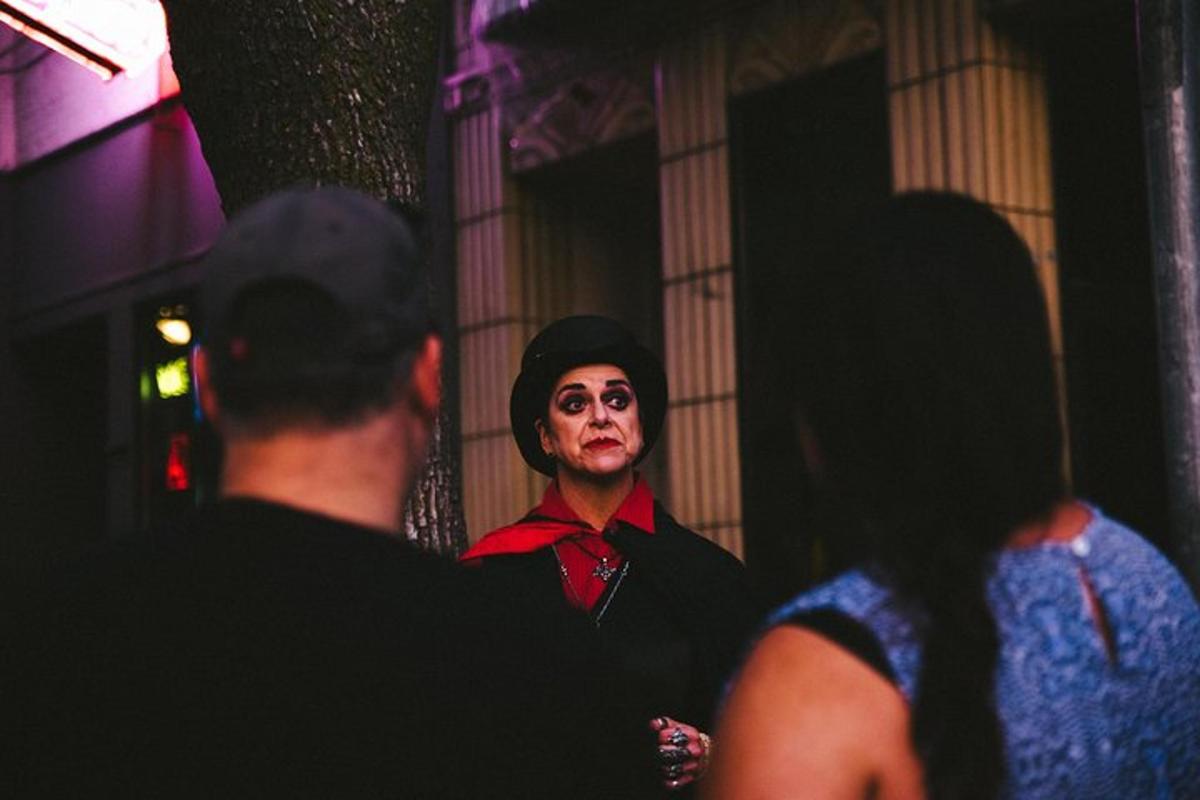 a man dressed as a clown looking in a mirror