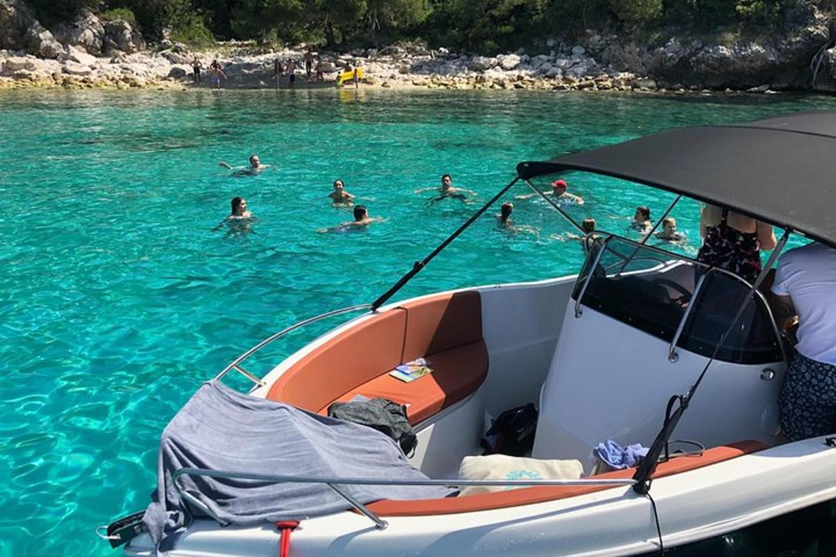 a group of people swimming in the water on a boat